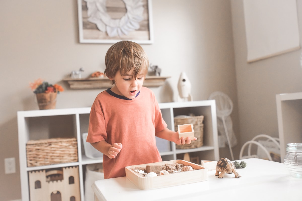 A child and ABA therapist playing and learning together at home